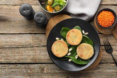 Healthy food high in vegetable fats and spices on wooden table, flat lay. Space for text