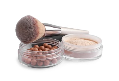 Photo of Different face powders and brush isolated on white