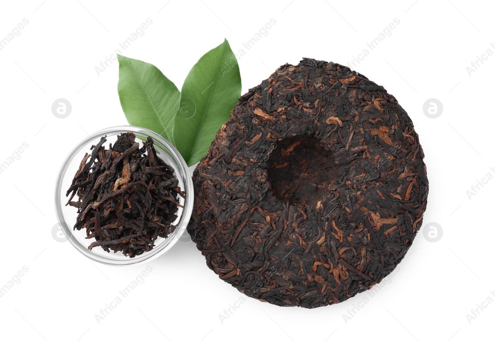 Photo of Traditional Chinese pu-erh tea and fresh leaves isolated on white, top view
