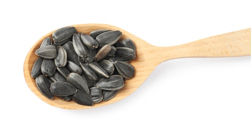 Photo of Raw organic sunflower seeds in wooden spoon isolated on white, top view