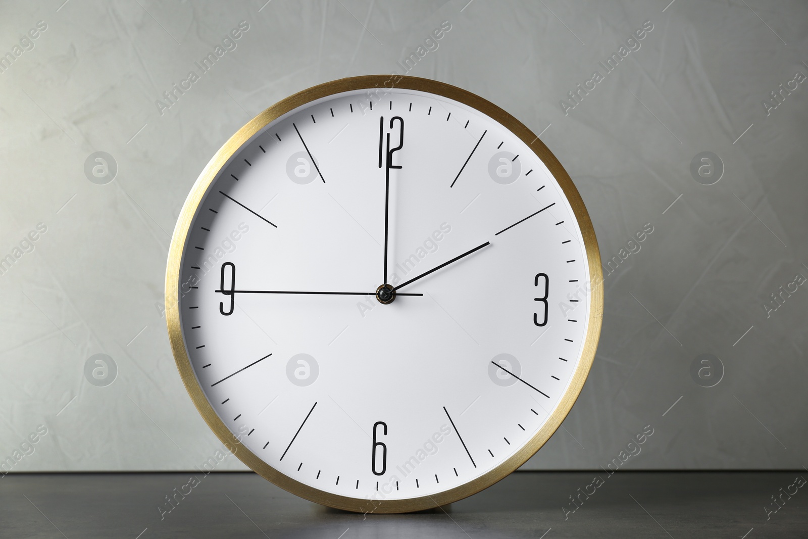 Photo of Big clock on table. Time change concept