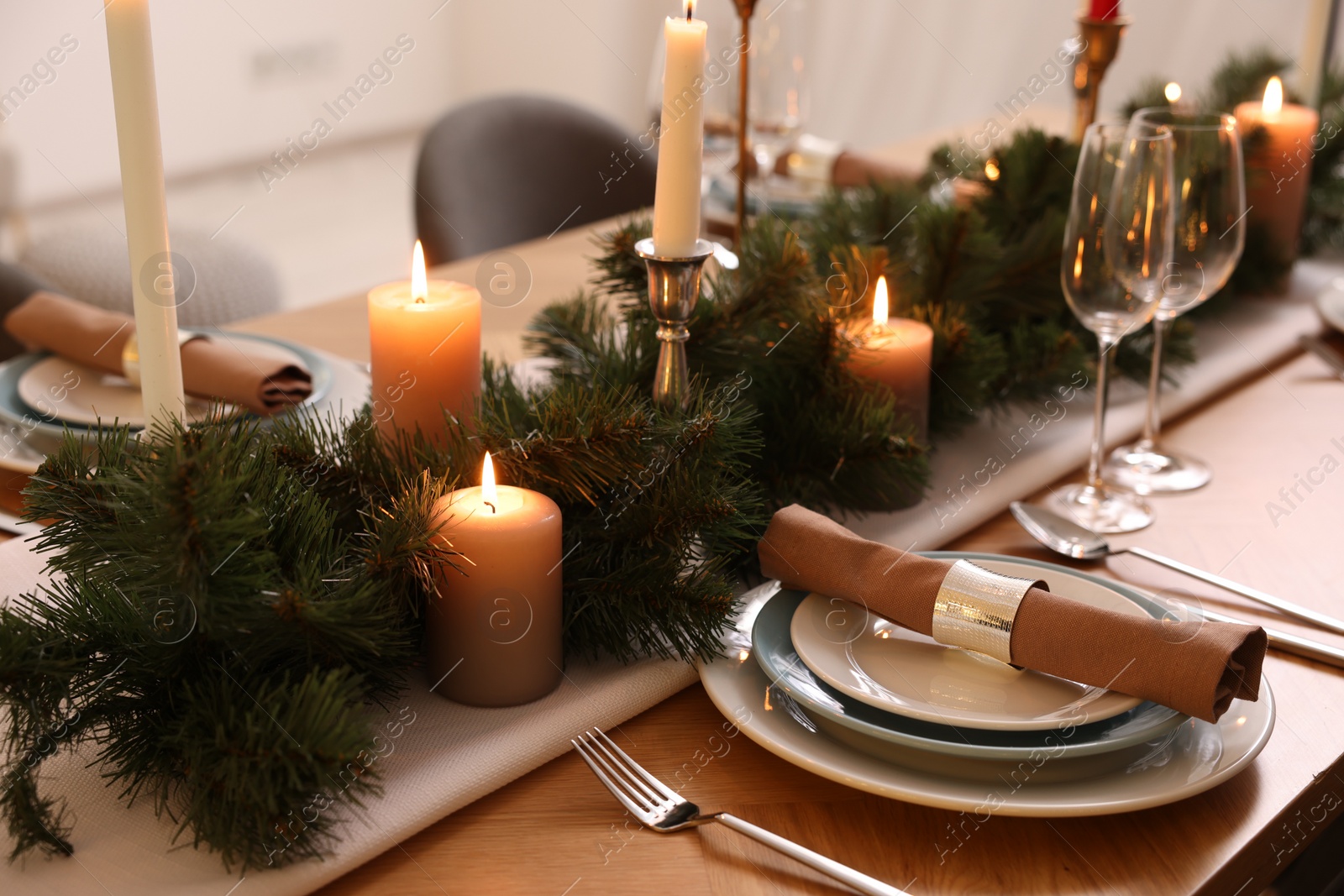 Photo of Luxury place setting with beautiful festive decor for Christmas dinner on wooden table