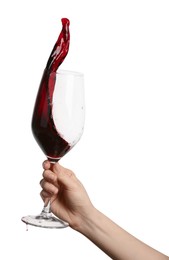 Woman with red wine splashing out of glass on white background, closeup