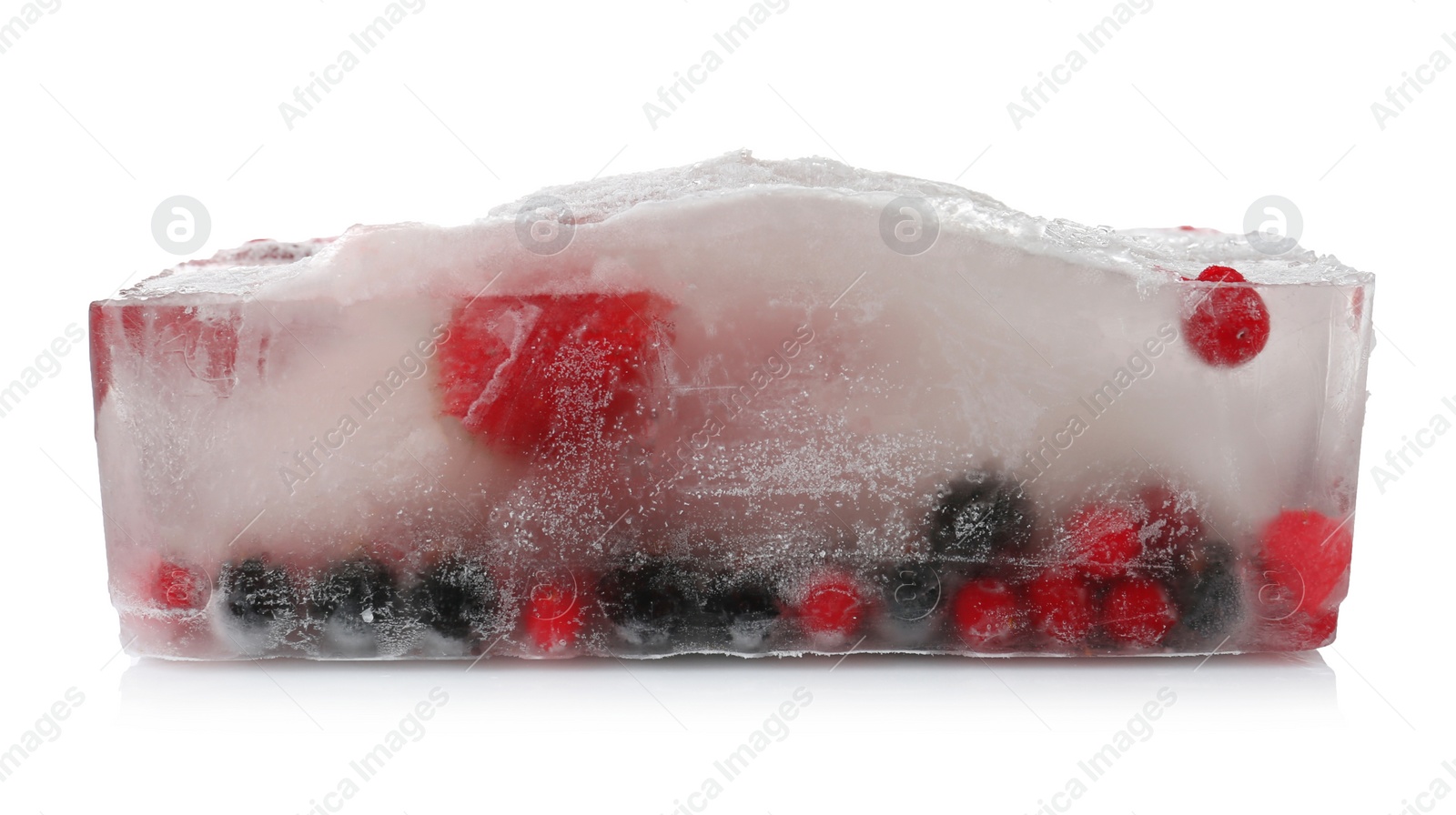 Photo of Raw berries frozen in ice cube on white background