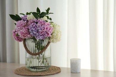 Photo of Bouquet of beautiful hydrangea flowers on table indoors, space for text. Interior design