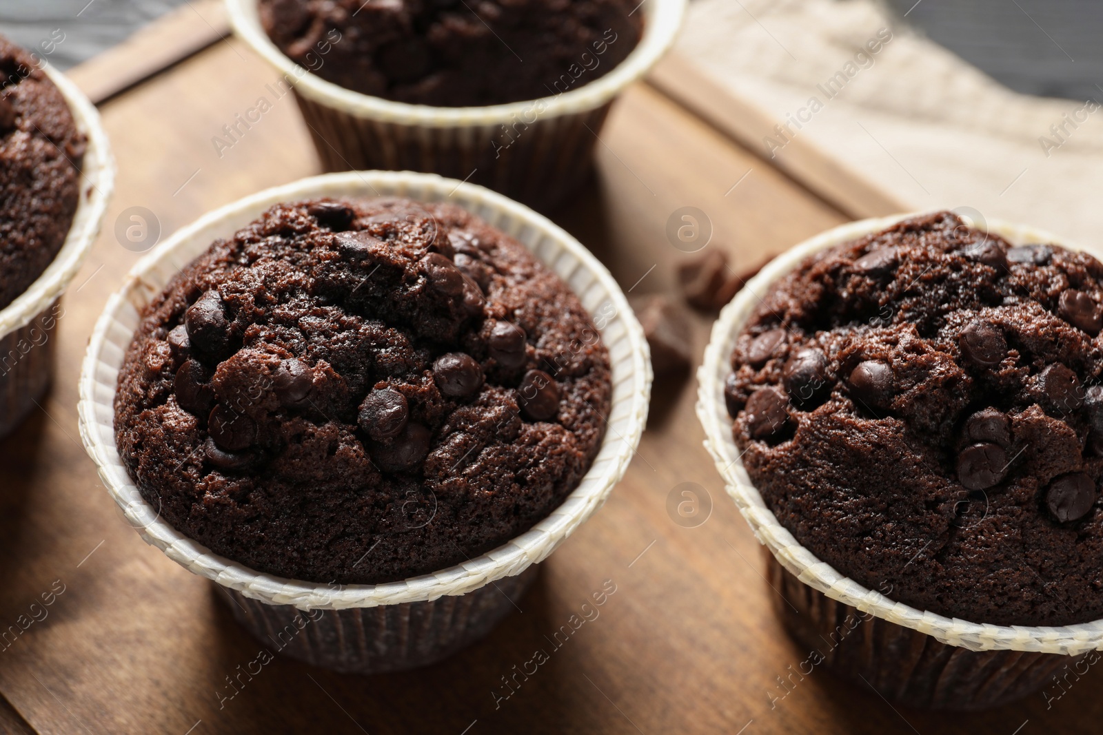 Photo of Delicious chocolate muffins on table, closeup view