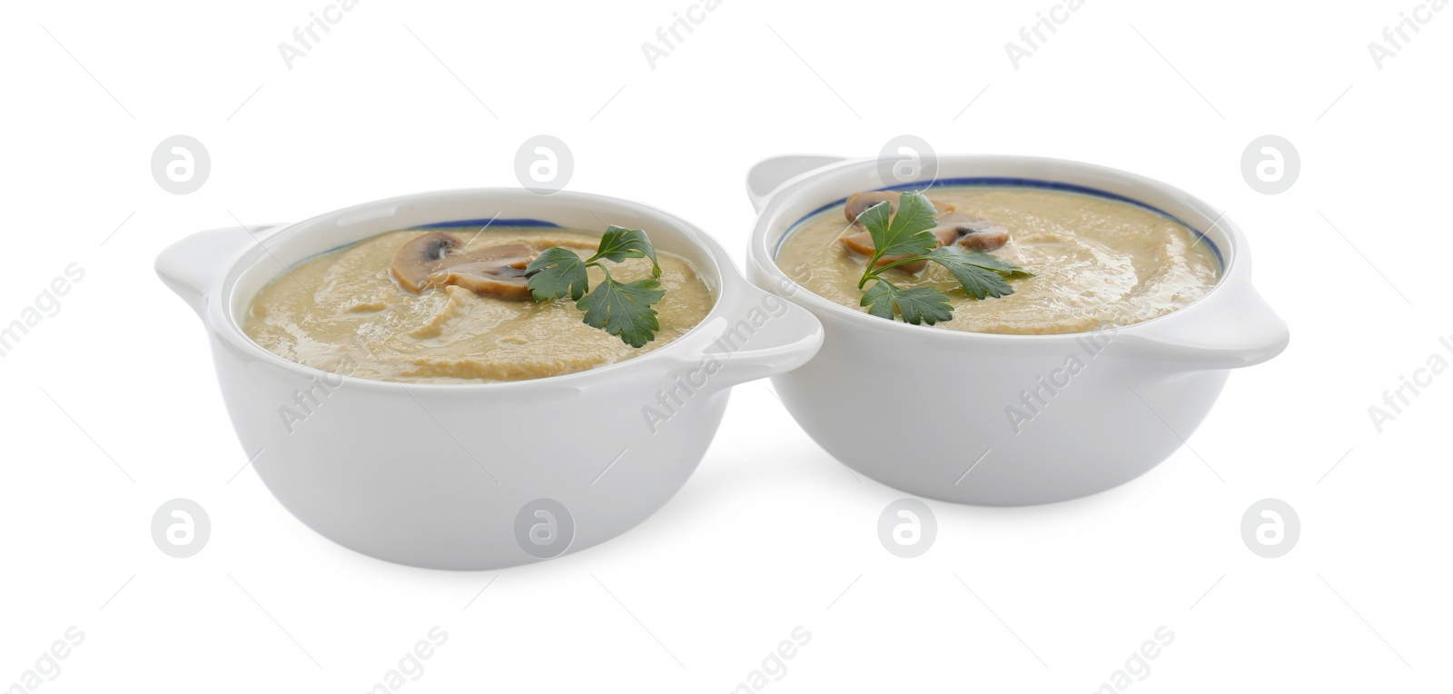 Photo of Delicious mushroom cream soup with parsley isolated on white