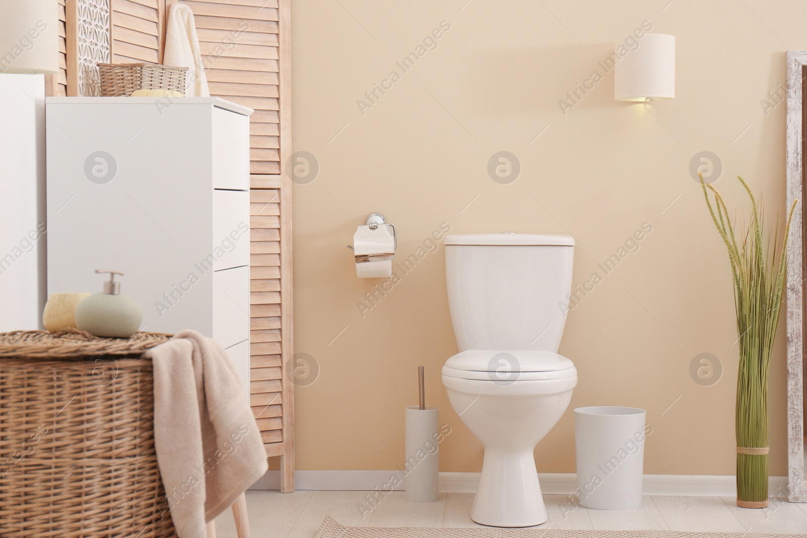 Photo of Toilet bowl in modern bathroom interior