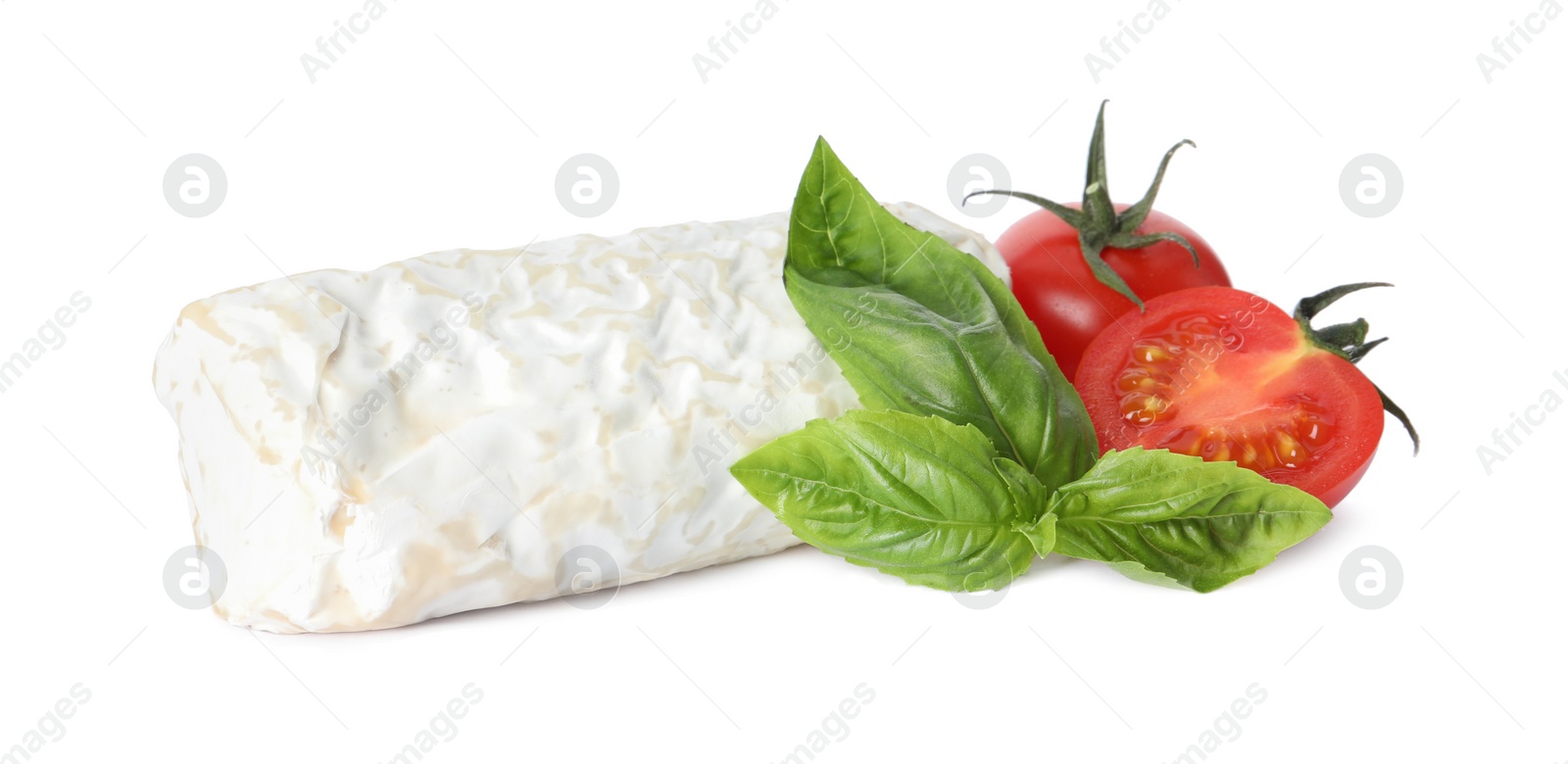 Photo of Delicious fresh goat cheese with basil and cherry tomatoes on white background