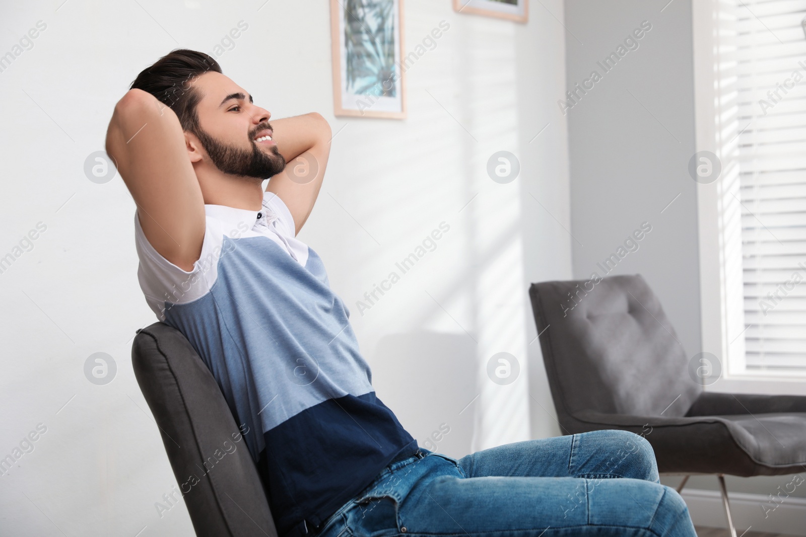 Photo of Young man relaxing at home. Peaceful rest