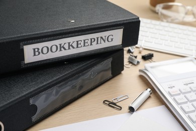 Bookkeeper's workplace with folders and documents on table