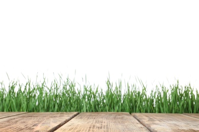 Wooden deck and green grass isolated on white