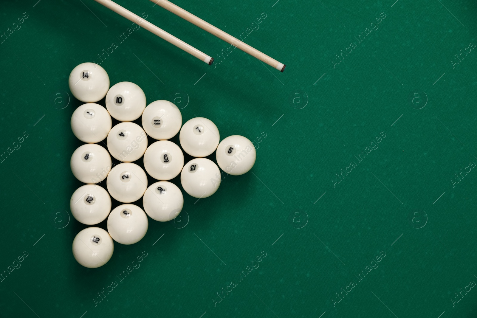 Photo of Flat lay composition with balls on billiard table. Space for text