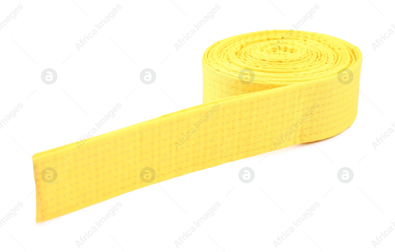 Photo of Yellow karate belt isolated on white. Martial arts uniform