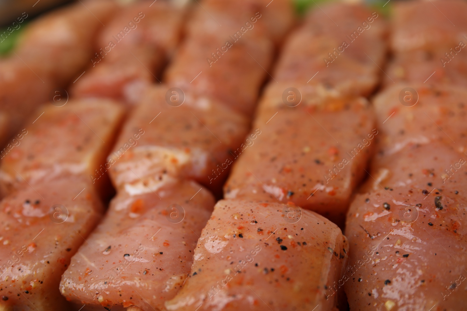 Photo of Cut raw marinated meat as background, closeup
