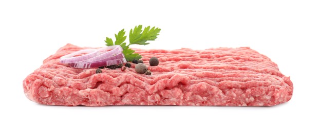 Raw ground meat, onion, peppercorns and parsley isolated on white