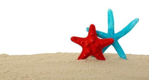 Photo of Honeymoon concept. Two sea stars and sand isolated on white