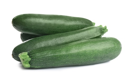 Fresh ripe green zucchinis isolated on white