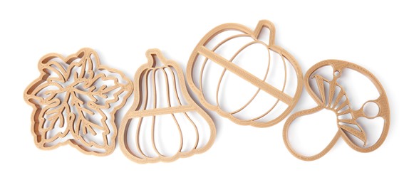 Cookie cutters of different shapes on white background, top view