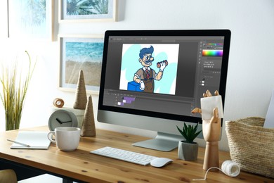 Image of Animator's workplace. Modern computer with illustration on screen