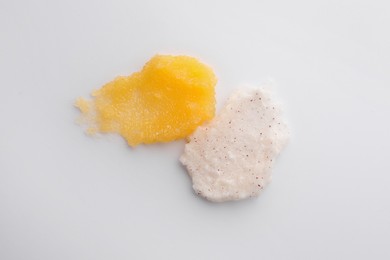 Photo of Samples of scrub on white background, top view