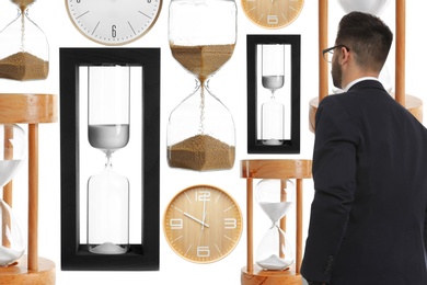 Image of Time management concept. Businessman standing in front of different hourglasses on white background