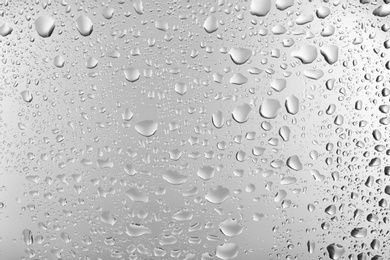 Photo of View of glass with water drops, closeup