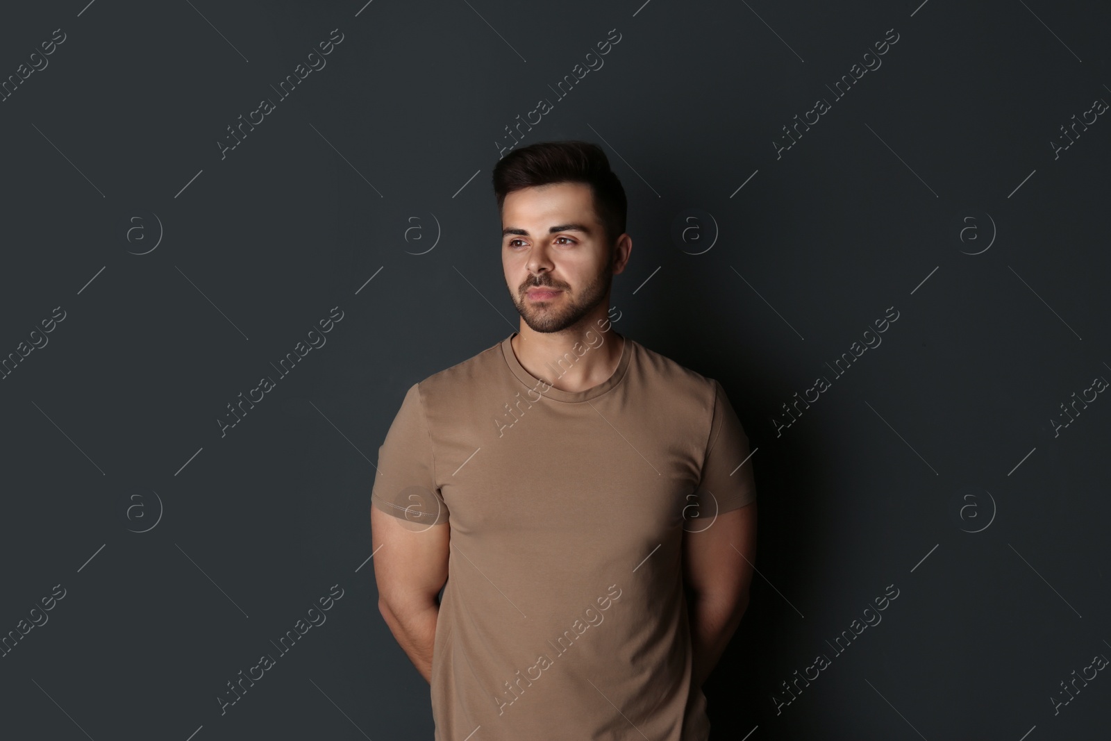 Photo of Portrait of handsome man on dark background