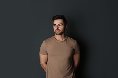 Photo of Portrait of handsome man on dark background