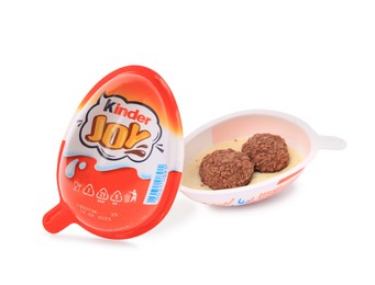 Photo of Slynchev Bryag, Bulgaria - May 24, 2023: Halves of Kinder Joy Egg with sweet candies on white background