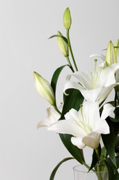 Beautiful bouquet of lily flowers on white background