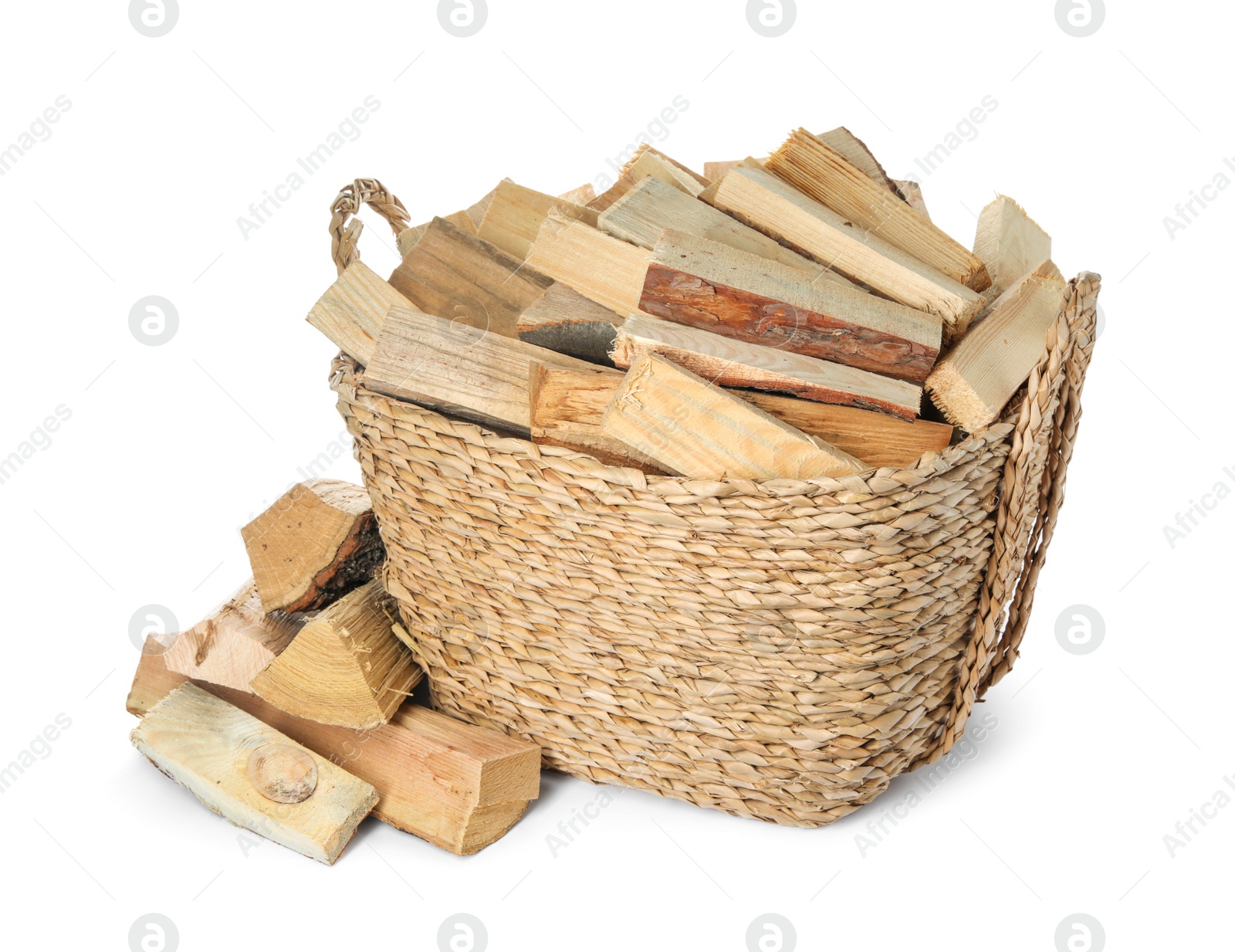 Photo of Wicker basket with cut firewood isolated on white