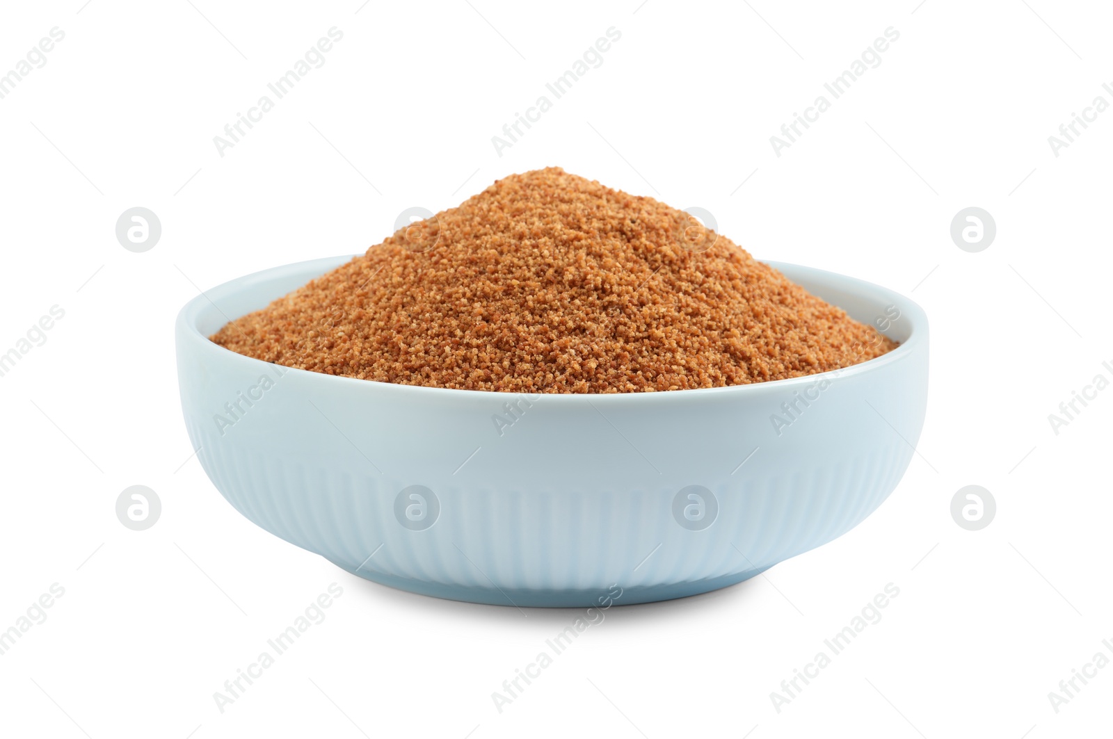 Photo of Natural coconut sugar in bowl isolated on white