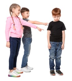 Photo of Kids pointing at upset boy on white background. Children's bullying
