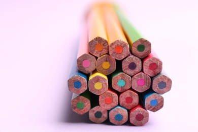 Different color pencils on light background, closeup