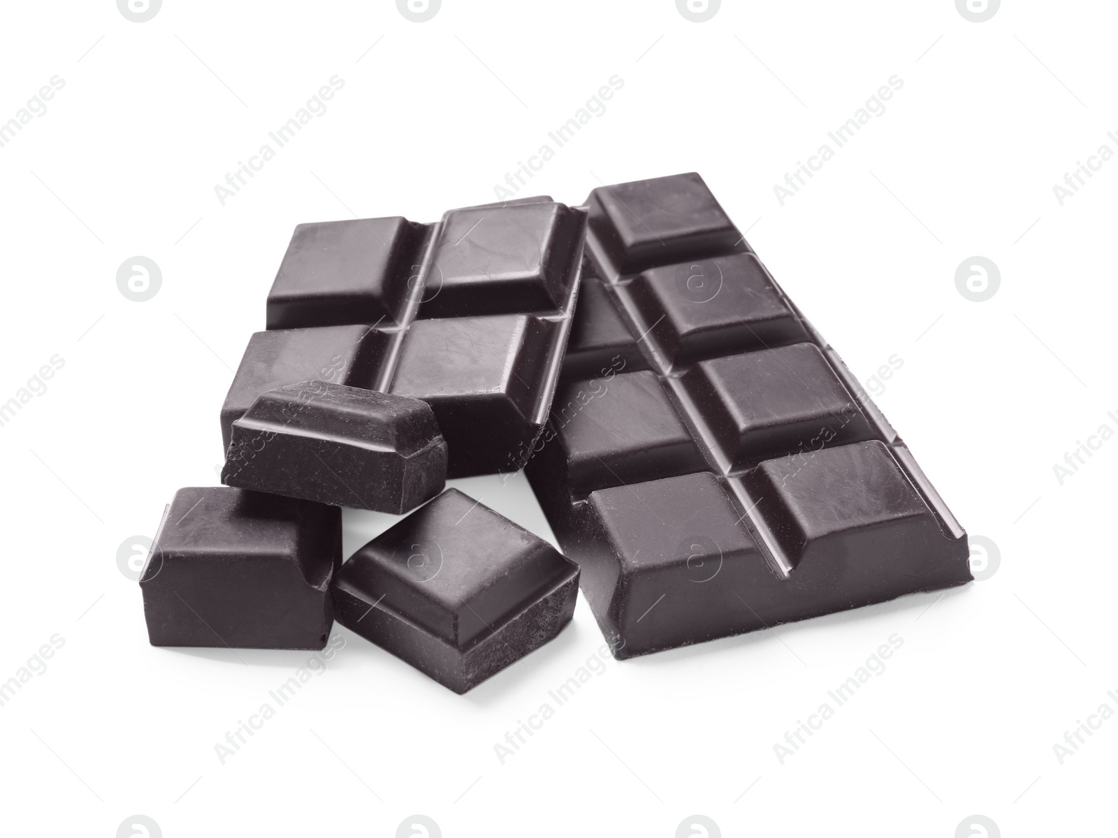 Photo of Pieces of delicious dark chocolate isolated on white