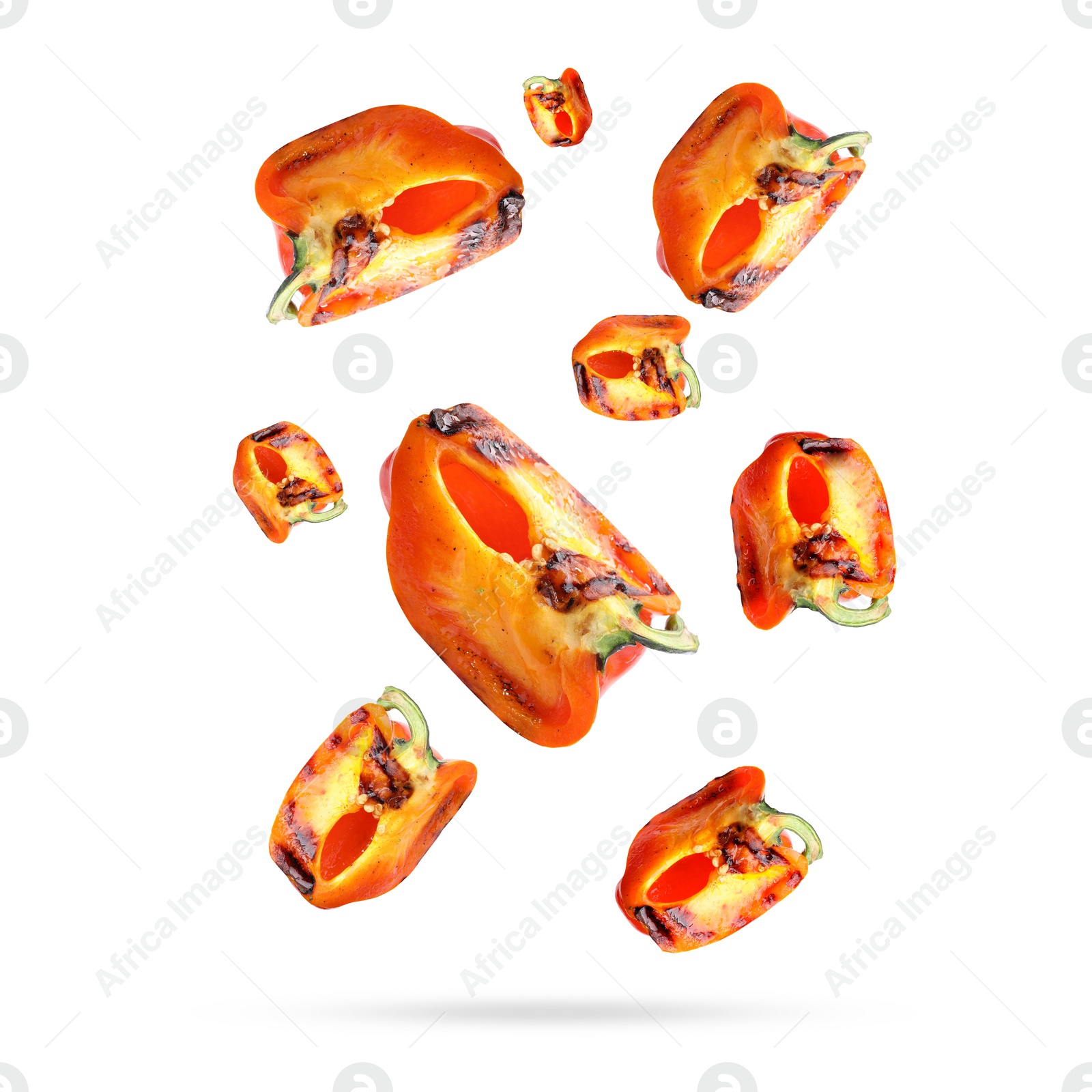 Image of Slices of grilled bell peppers in air on white background