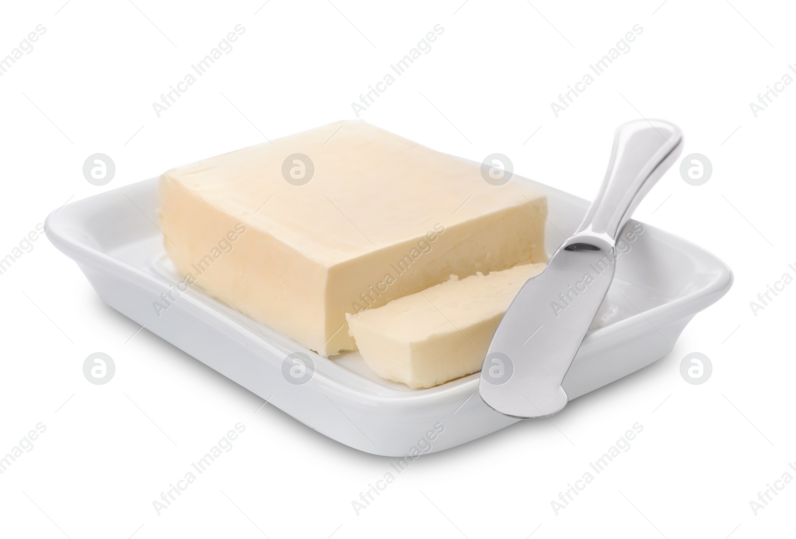 Photo of Plate with tasty fresh butter and knife on white background