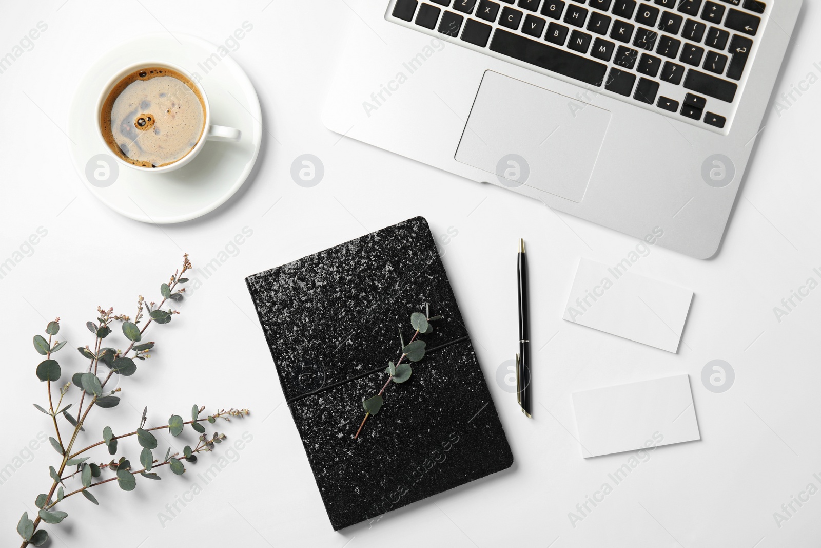 Photo of Flat lay composition with glittering notebook and laptop on white background