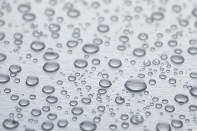 Water drops on white background, closeup view