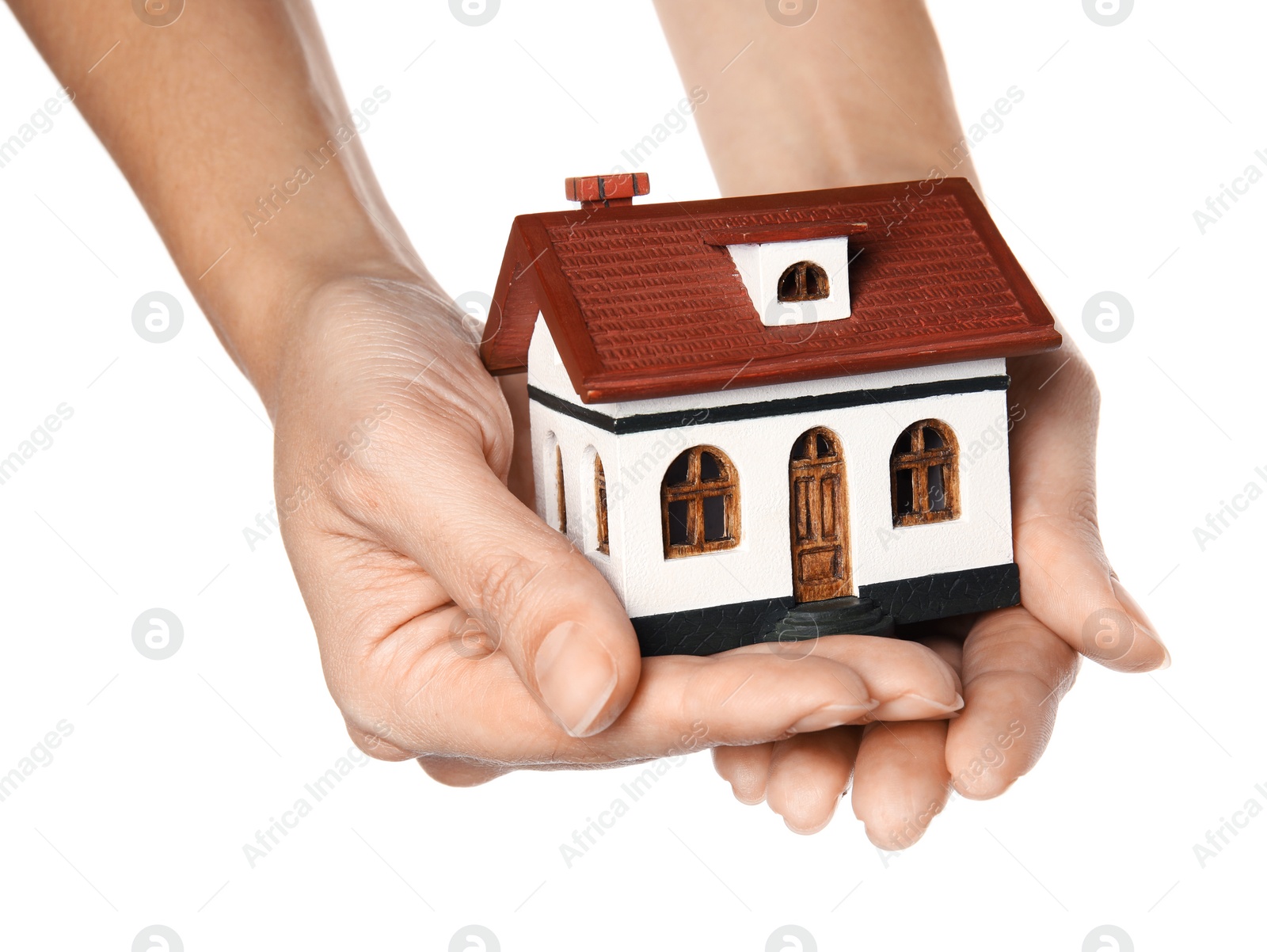 Photo of Woman holding house model in hands on white background