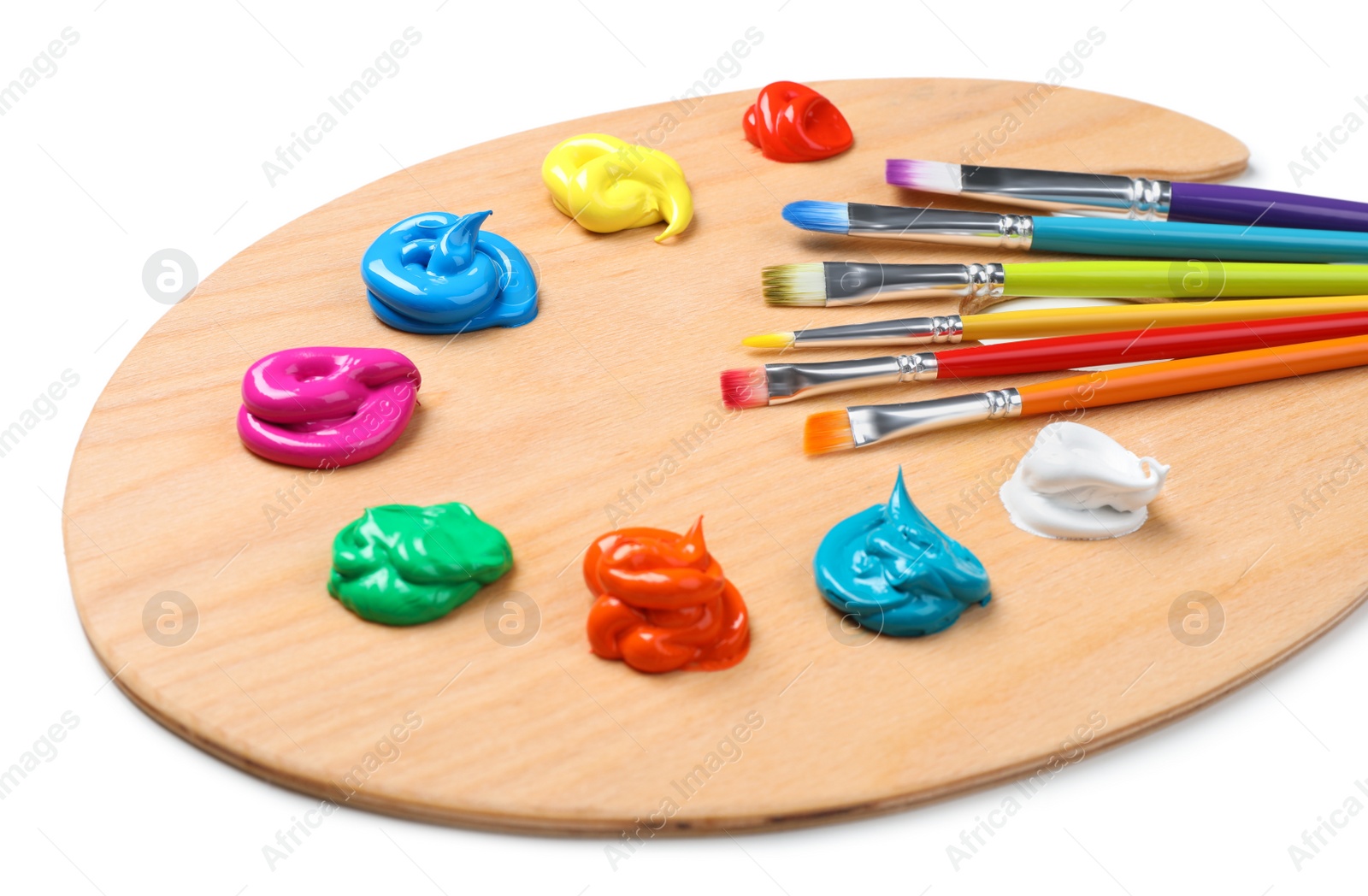 Photo of Palette with paints and brushes on white background. Artist equipment