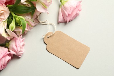 Photo of Happy Mother's Day. Beautiful flowers with blank card on light background, flat lay