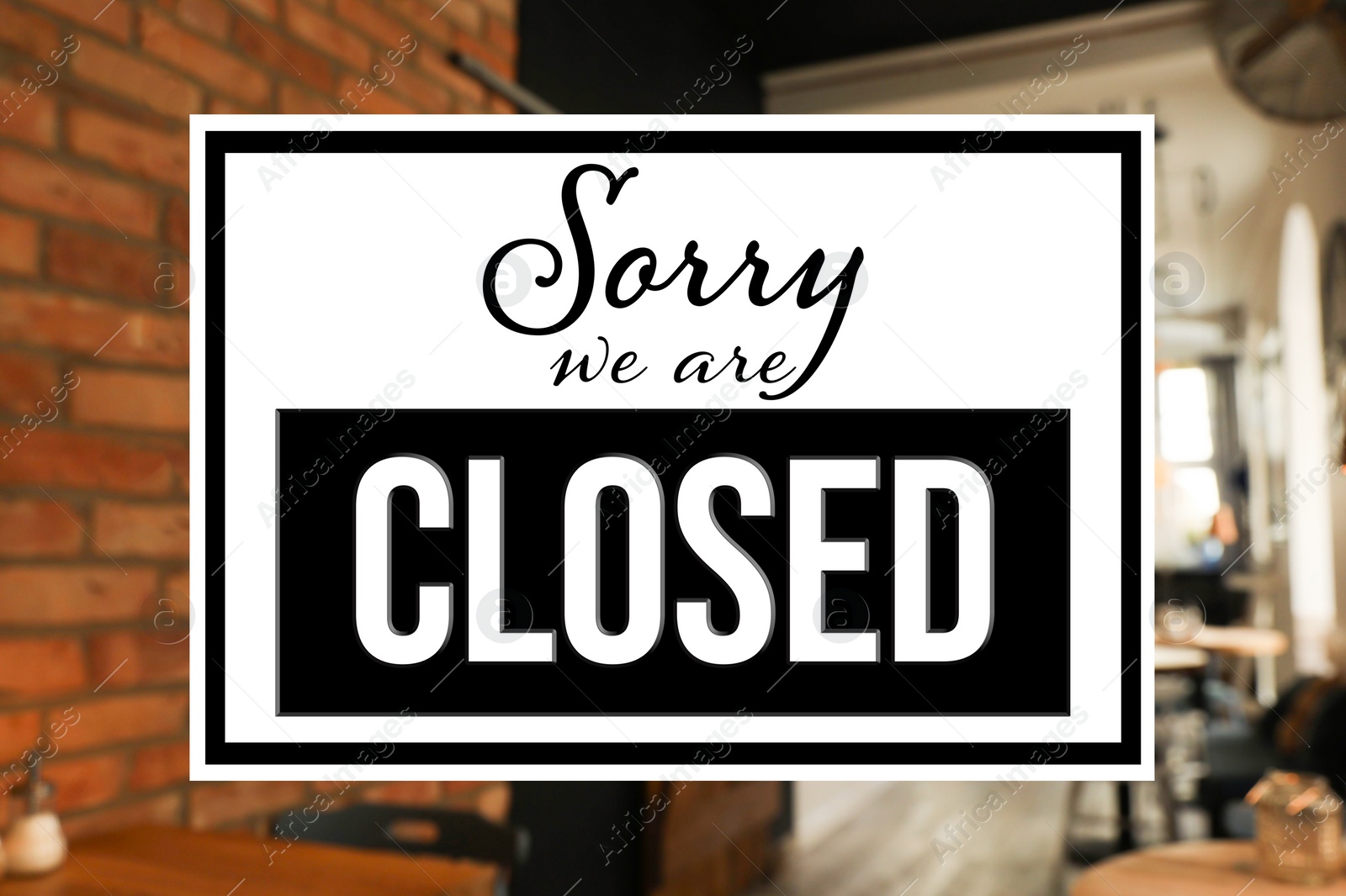 Image of Sorry we are closed sign against blurred background