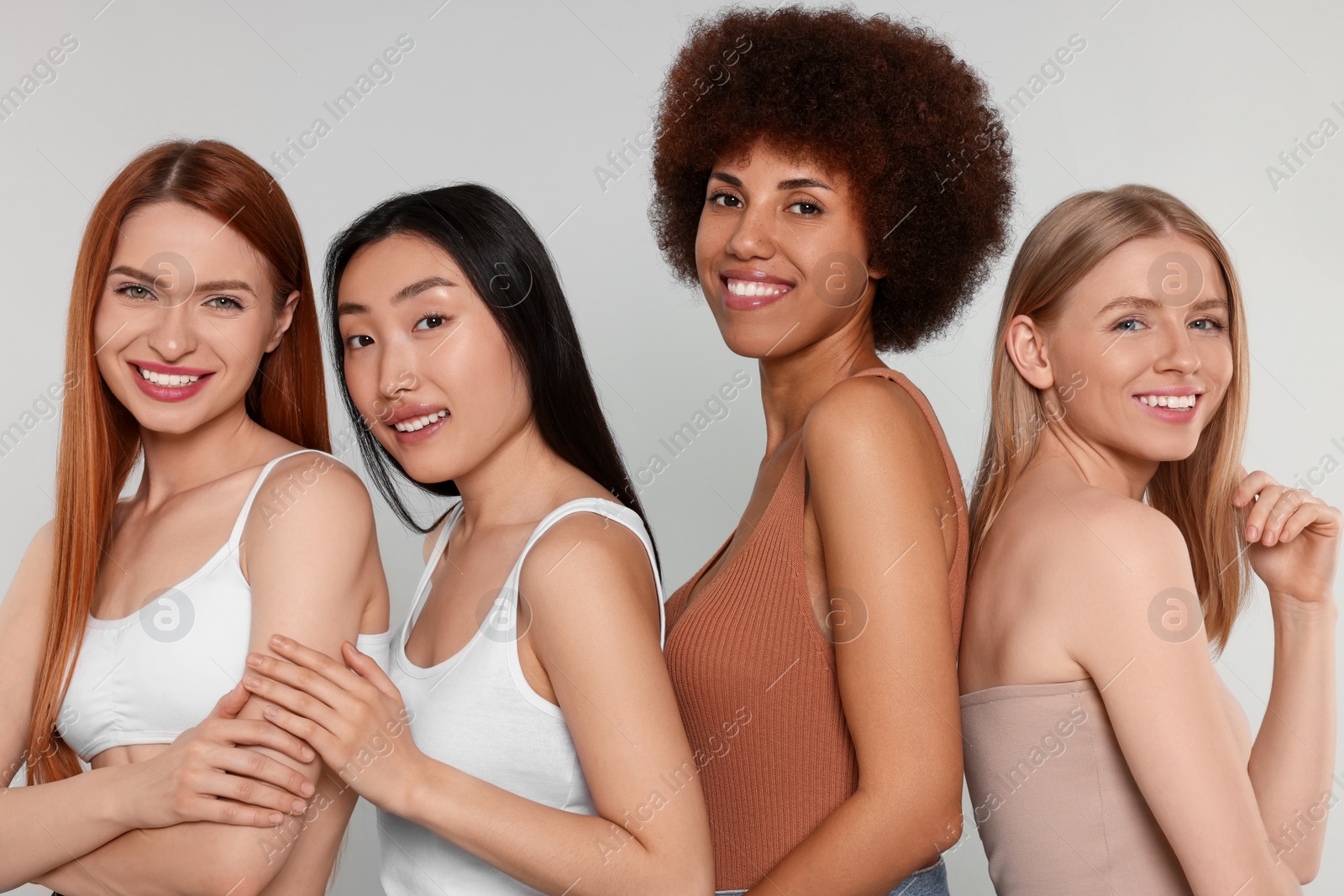 Photo of Portrait of beautiful young women on light grey background