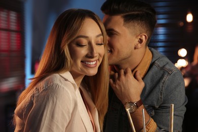 Man and woman flirting with each other in bar