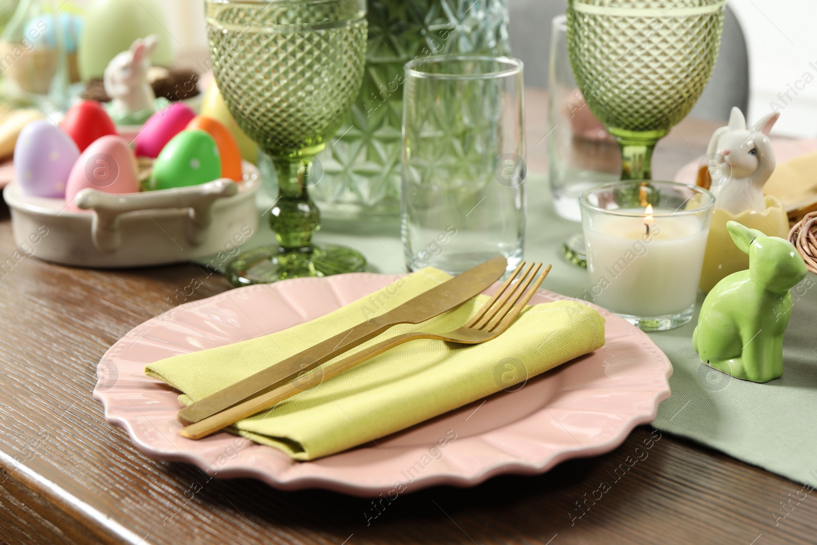 Photo of Easter celebration. Festive table setting with painted eggs.