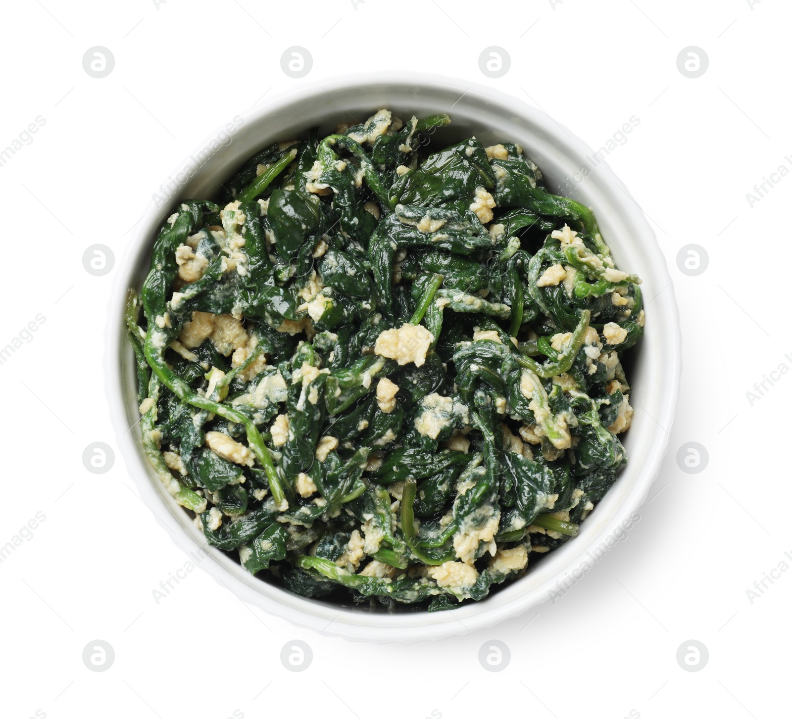 Photo of Tasty spinach dip with egg in bowl isolated on white, top view