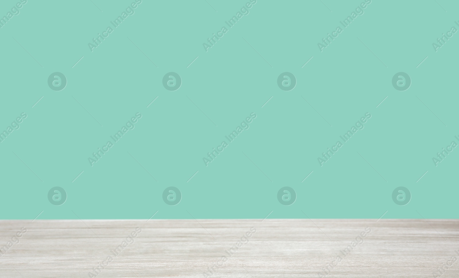 Image of Empty wooden surface on mint background. Mockup for design