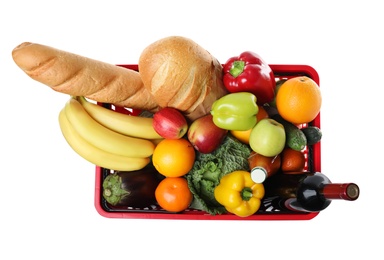 Photo of Shopping basket with grocery products on white background, top view